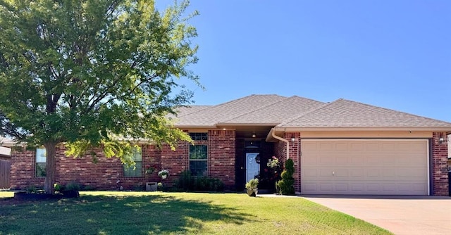 ranch-style house featuring a front lawn, roof with shingles, brick siding, concrete driveway, and an attached garage