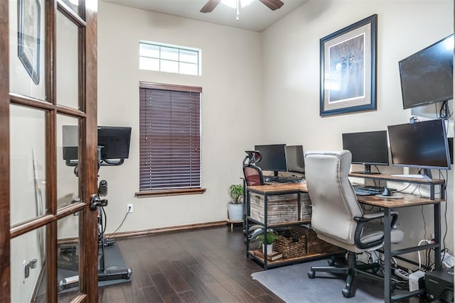 office area featuring baseboards, ceiling fan, and wood finished floors