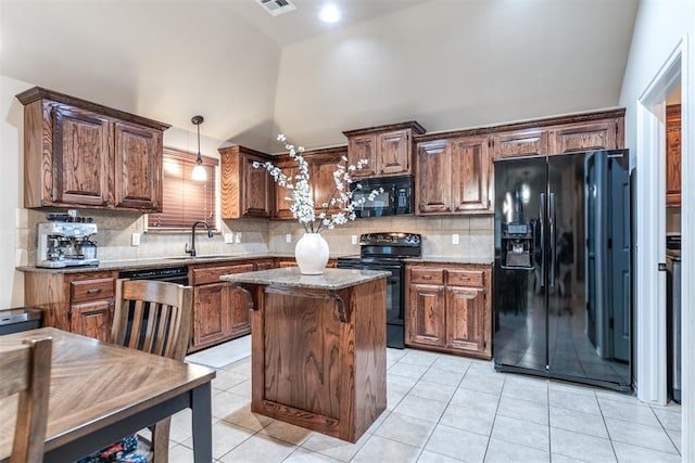 kitchen with backsplash, a center island, a sink, black appliances, and lofted ceiling