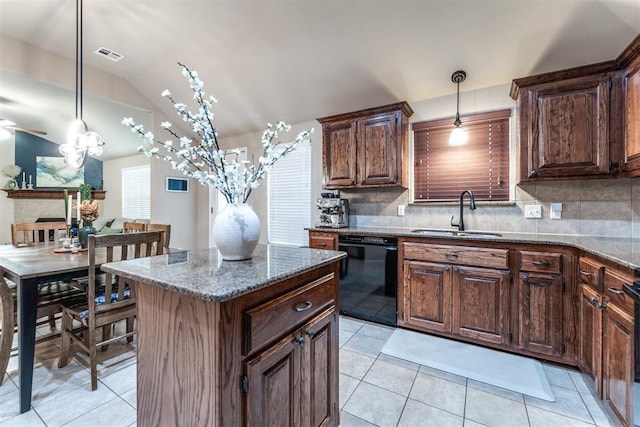 kitchen with a sink, black dishwasher, light tile patterned floors, tasteful backsplash, and visible vents