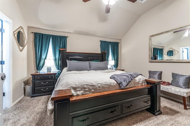 carpeted bedroom with baseboards, ceiling fan, and vaulted ceiling