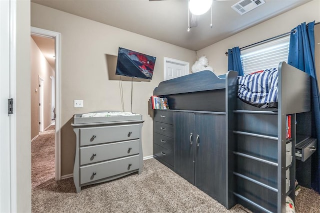 bedroom with a ceiling fan, baseboards, visible vents, and carpet