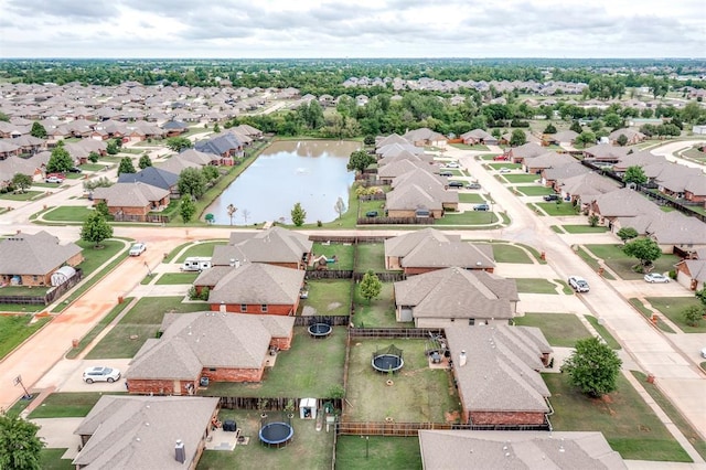 aerial view featuring a water view and a residential view