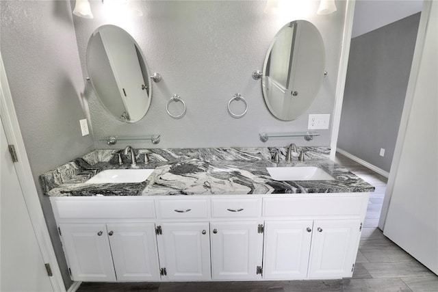 bathroom with double vanity and a sink