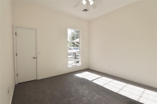 unfurnished room featuring carpet floors, ceiling fan, visible vents, and baseboards