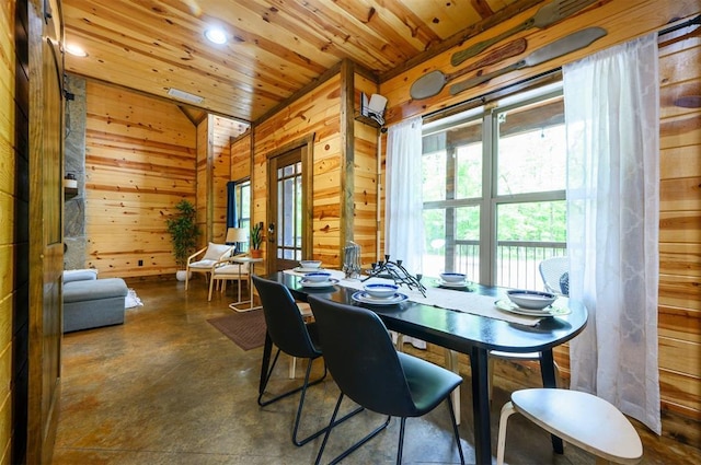 678 N State Highway 259a, Broken Bow, OK 74728 - dining area featuring wooden walls, recessed lighting, wooden ceiling, concrete floors, and vaulted ceiling