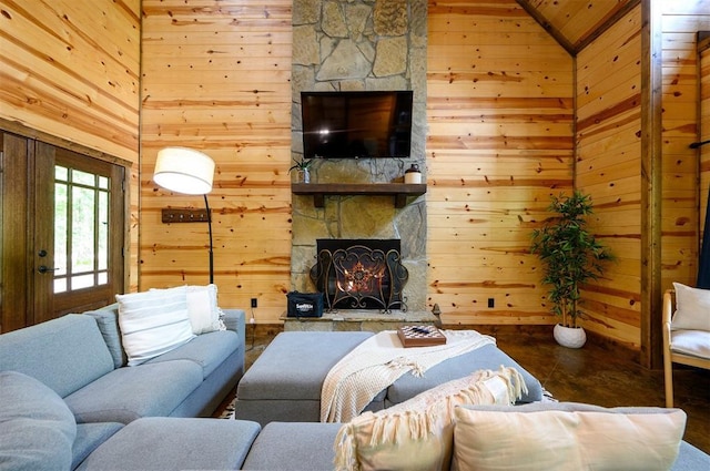 678 N State Highway 259a, Broken Bow, OK 74728 - living room featuring a stone fireplace and wood walls