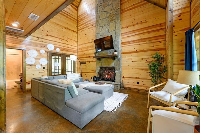 678 N State Highway 259a, Broken Bow, OK 74728 - living area featuring visible vents, wood walls, concrete flooring, high vaulted ceiling, and wooden ceiling