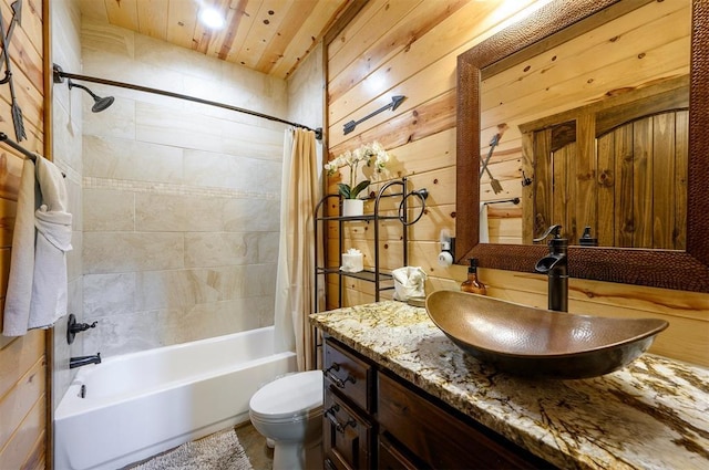 678 N State Highway 259a, Broken Bow, OK 74728 - bathroom featuring toilet, wood walls, shower / bath combination with curtain, and vanity
