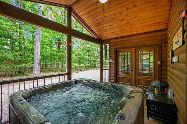 678 N State Highway 259a, Broken Bow, OK 74728 - sunroom featuring ceiling fan, a hot tub, and french doors