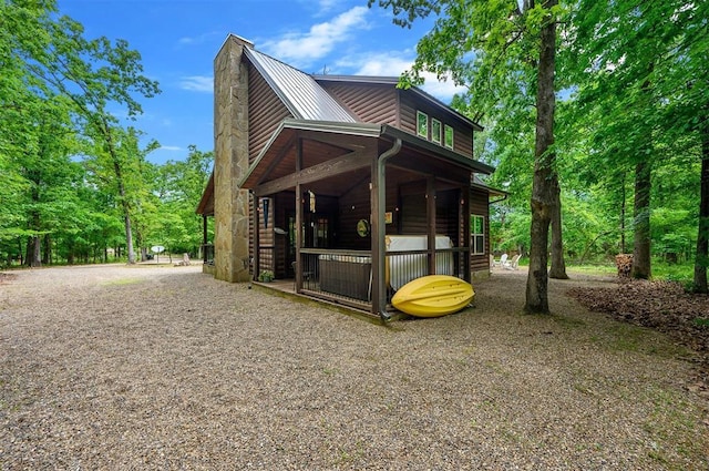 678 N State Highway 259a, Broken Bow, OK 74728 - view of side of home with faux log siding and metal roof