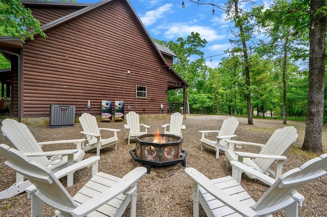 678 N State Highway 259a, Broken Bow, OK 74728 - view of patio / terrace featuring central air condition unit and an outdoor fire pit