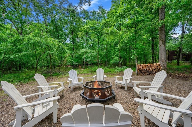678 N State Highway 259a, Broken Bow, OK 74728 - view of patio featuring an outdoor fire pit