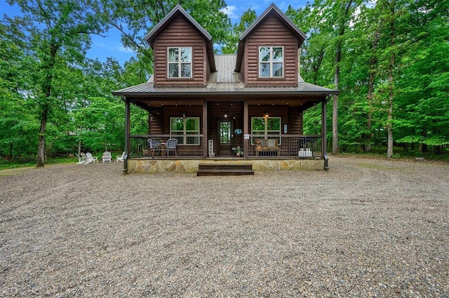 678 N State Highway 259a, Broken Bow, OK 74728 - view of front of house with a porch, driveway, and metal roof
