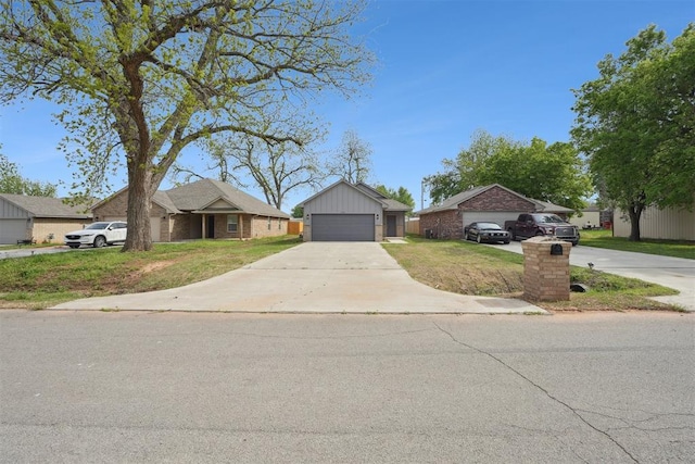 ranch-style home featuring brick siding and a front yard