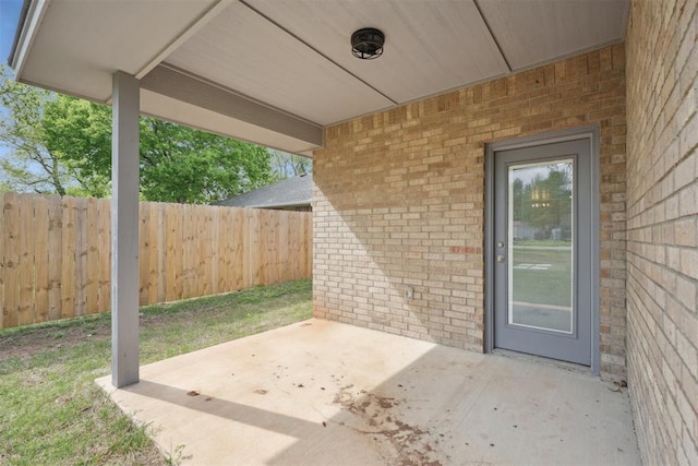 view of patio / terrace featuring fence