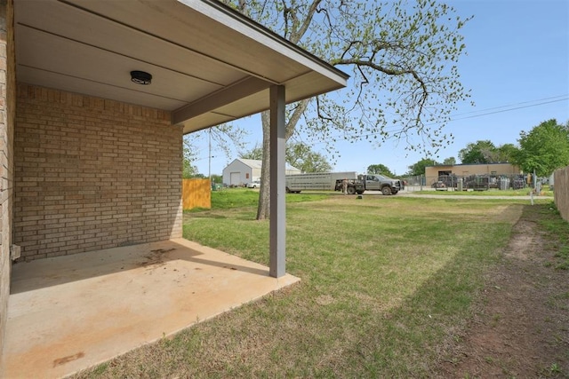 view of yard with fence and a patio area