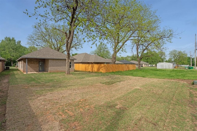view of yard with fence