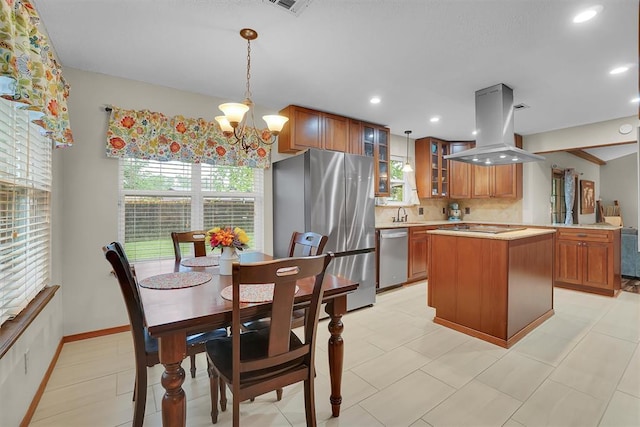 dining room featuring recessed lighting, a chandelier, and a wealth of natural light