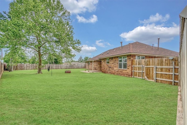 view of yard featuring a fenced backyard and a patio area