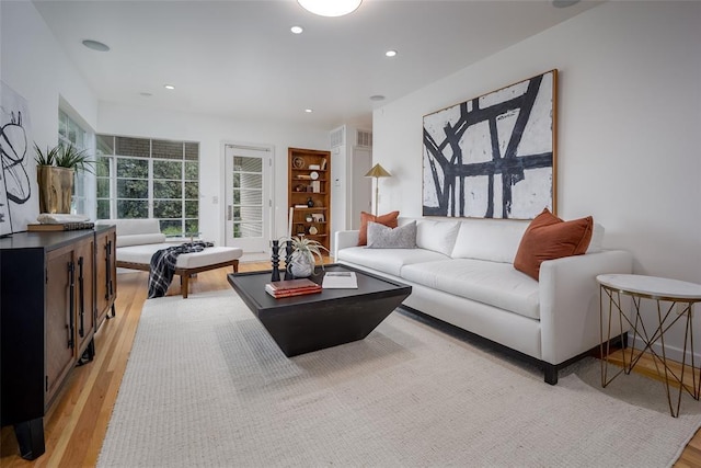 1000 NW 37th St Unit 1000 & 1002, Oklahoma City, OK 73118 - living room with recessed lighting, visible vents, and light wood-type flooring