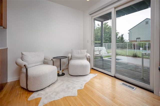 1000 NW 37th St Unit 1000 & 1002, Oklahoma City, OK 73118 - sitting room with wood-type flooring, baseboards, and visible vents