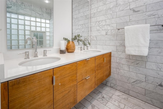 1000 NW 37th St Unit 1000 & 1002, Oklahoma City, OK 73118 - bathroom featuring double vanity, a sink, marble finish floor, and tile walls