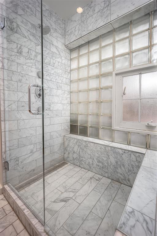 1000 NW 37th St Unit 1000 & 1002, Oklahoma City, OK 73118 - bathroom with marble finish floor and a stall shower