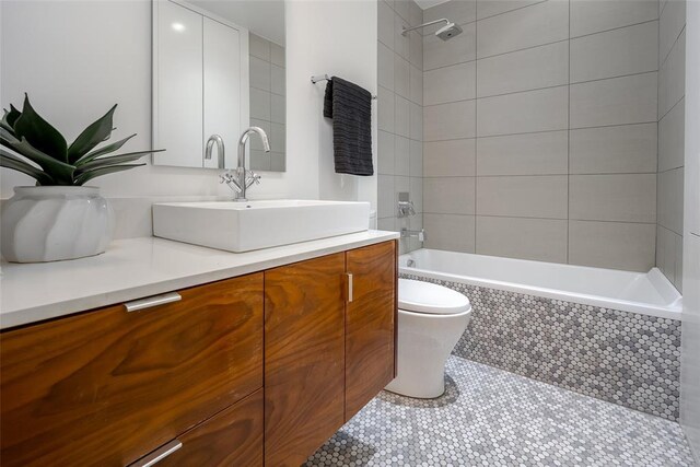 1000 NW 37th St Unit 1000 & 1002, Oklahoma City, OK 73118 - bathroom featuring vanity, tile patterned floors, toilet, and tiled shower / bath combo