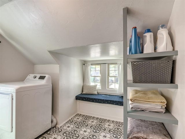laundry area with baseboards and washer / clothes dryer