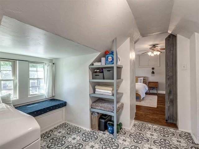 bedroom with baseboards and lofted ceiling