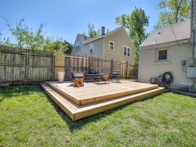 wooden terrace with fence and a lawn