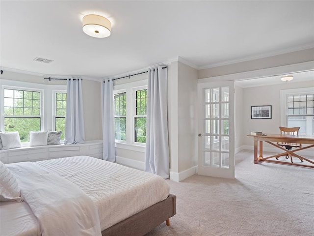 bedroom featuring carpet floors, ornamental molding, baseboards, and visible vents
