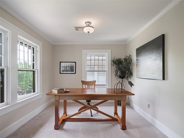 office space featuring crown molding, baseboards, visible vents, and light carpet