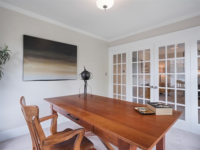 carpeted office space featuring ornamental molding and french doors