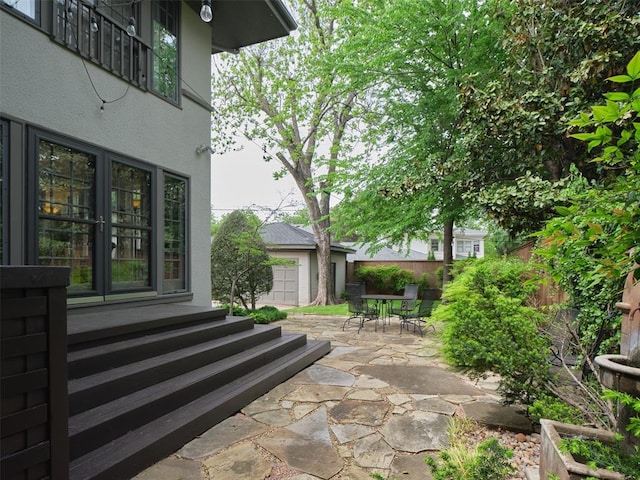 view of patio / terrace featuring fence and outdoor dining area
