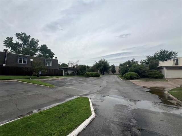 view of street with street lighting and curbs