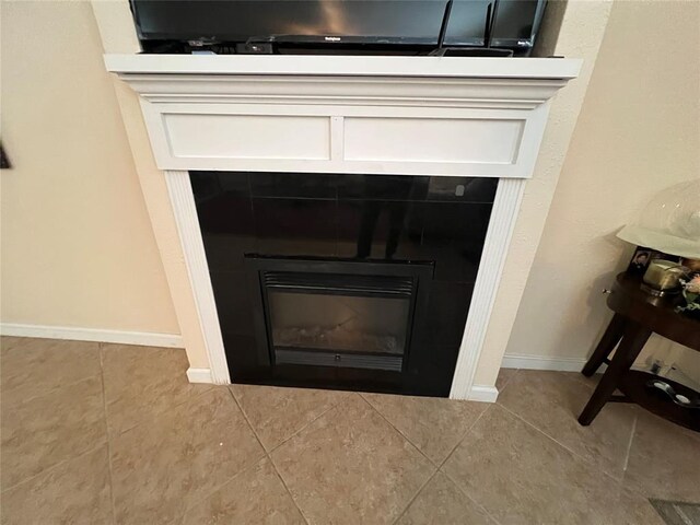 details with baseboards and a fireplace