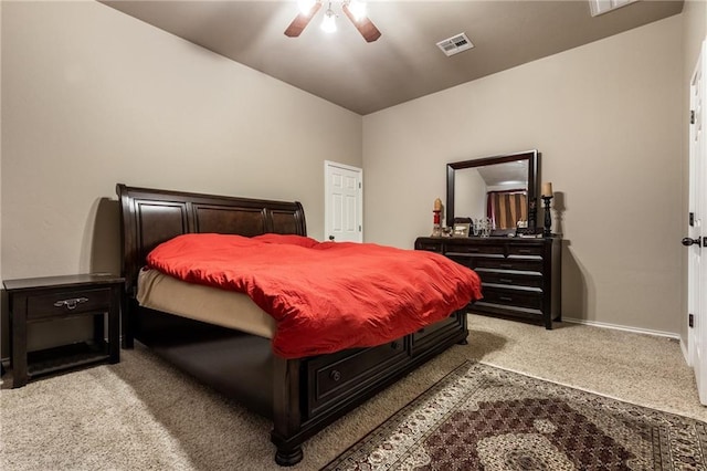 carpeted bedroom featuring a ceiling fan, baseboards, and visible vents