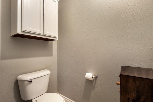 bathroom featuring toilet