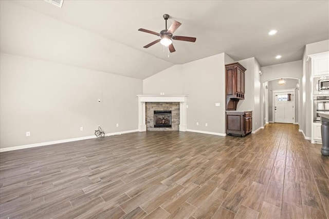1016 NW 191st St, Edmond, OK 73012 - unfurnished living room with baseboards, a fireplace, a ceiling fan, and dark wood-style flooring