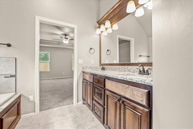 1016 NW 191st St, Edmond, OK 73012 - bathroom featuring double vanity, a ceiling fan, tile patterned flooring, a sink, and baseboards