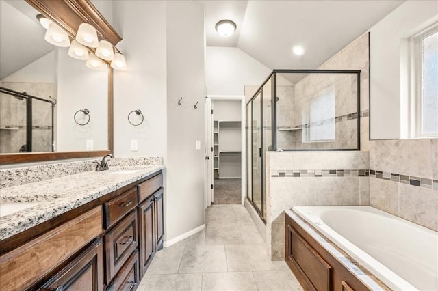 1016 NW 191st St, Edmond, OK 73012 - bathroom with double vanity, a bath, a shower stall, vaulted ceiling, and a sink