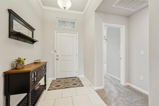 9104 SW 47th St, Oklahoma City, OK 73179 - foyer entrance with visible vents, baseboards, crown molding, and light tile patterned floors