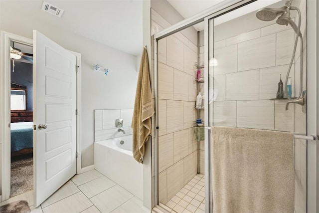 9104 SW 47th St, Oklahoma City, OK 73179 - ensuite bathroom featuring tile patterned flooring, a shower stall, ensuite bathroom, visible vents, and a bath
