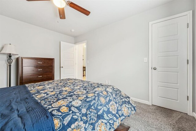 9104 SW 47th St, Oklahoma City, OK 73179 - bedroom featuring carpet floors, baseboards, and a ceiling fan