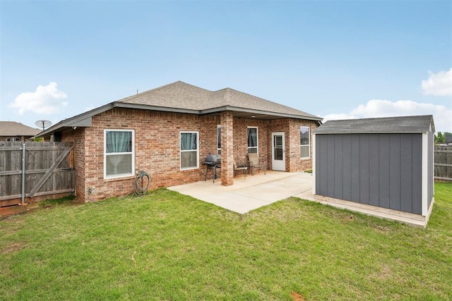 9104 SW 47th St, Oklahoma City, OK 73179 - back of house featuring a storage unit, brick siding, a fenced backyard, a patio area, and an outdoor structure