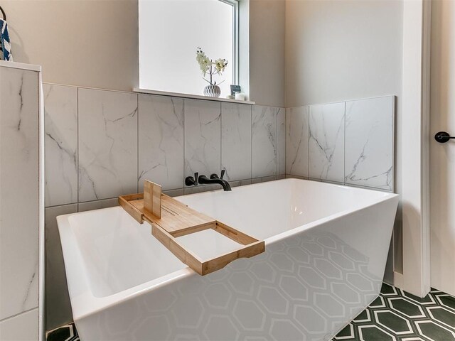 bathroom featuring a freestanding bath