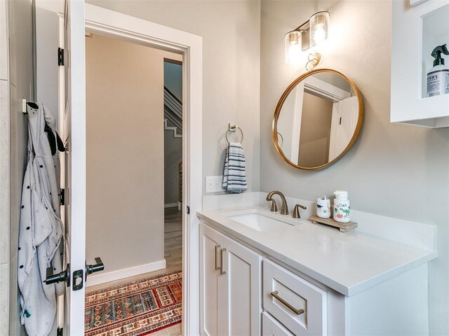 bathroom with vanity and baseboards