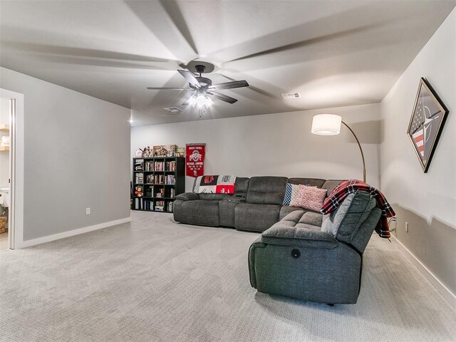 living room with carpet floors, ceiling fan, baseboards, and visible vents